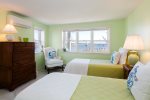 Lower level twin bedroom with water views